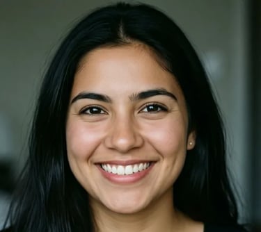 Close-up portrait of a smiling woman with long black hair and a natural look.