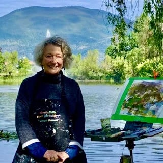 a woman in a black dress and a painting
