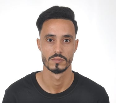man standing near white wall