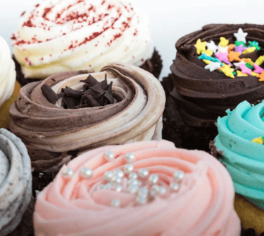 a grouping of delicious cupcakes.