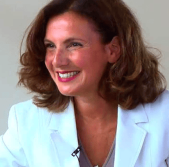 a woman in a white jacket and a white shirt