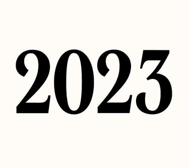 Bold black typography of the year 2023 set against a clean white background.
