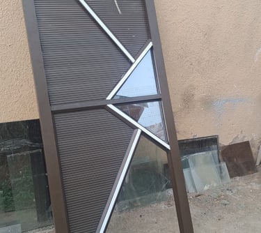 Aluminium door being adjusted and resized for correct fitting