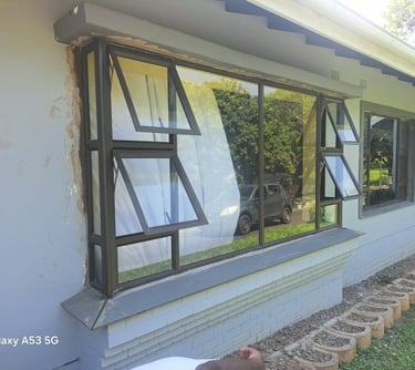 Aluminium window and door repair technician fixing a sliding door in Durban