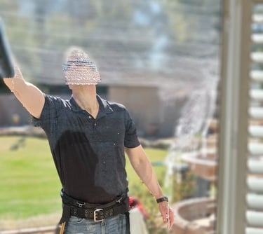 man washing a home window