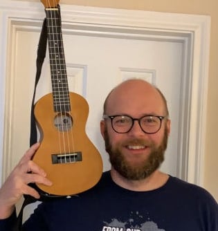 Blair Raker ukulele instructor posing with ukulele