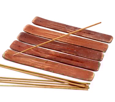 a bunch of sticks sticking out of a wooden sticker