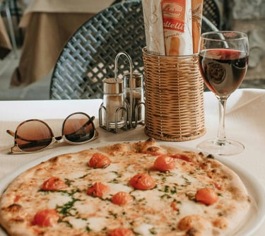 Italian food featuring pizza and wine