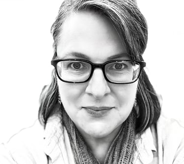 Smiling portrait of the artist behind She Who Creates Art