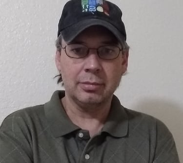 a man in a hat and glasses