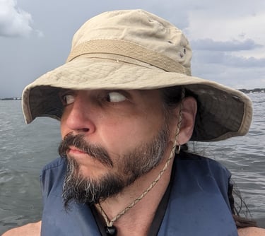 a man with a hat on a boat