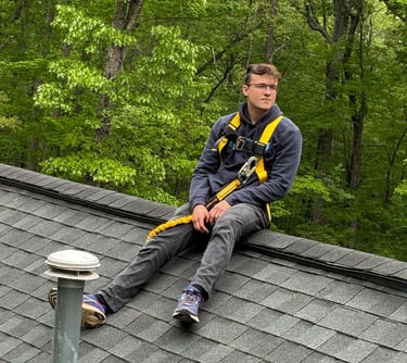 a man sitting on a roof top of a roof
