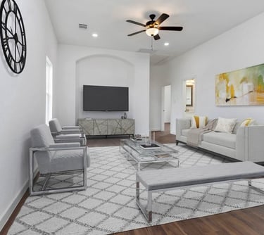 Spacious living room with vaulted ceilings and natural light in custom-built Wimberley home