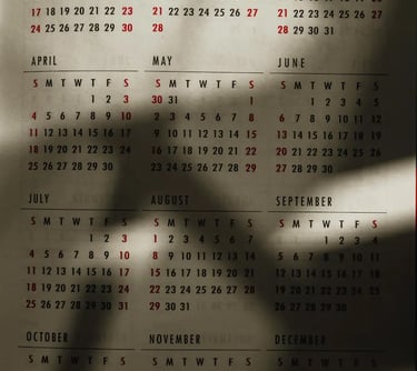 Full 2021 wall calendar page showing 12 months with natural leaf shadows across the dates.