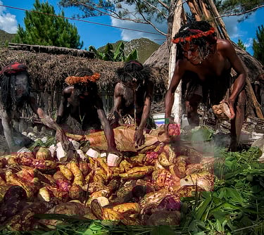 cooking method uses a pit in the ground combined with heated stones