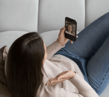 a woman is taking a selfie with her phone