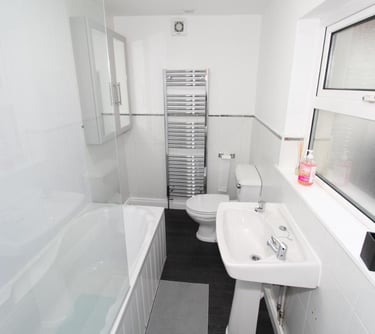 bathroom with over bath shower