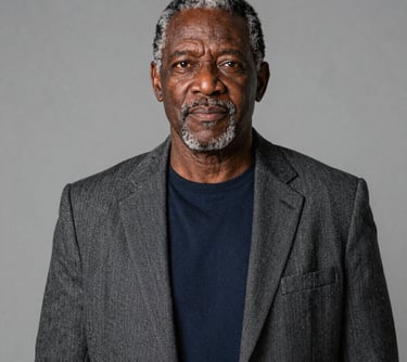 man standing near white wall