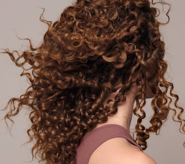 a woman with curly hair