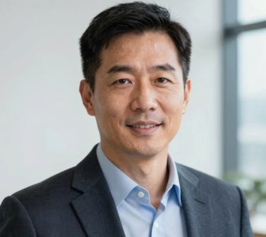 A professional headshot of a business leader in a US professional setting, with clean lighting and a background featuring white and light blue tones.