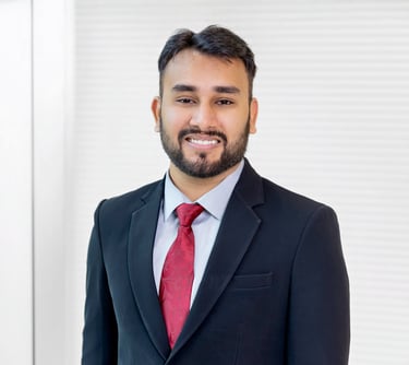 a man in a suit and tie smiling