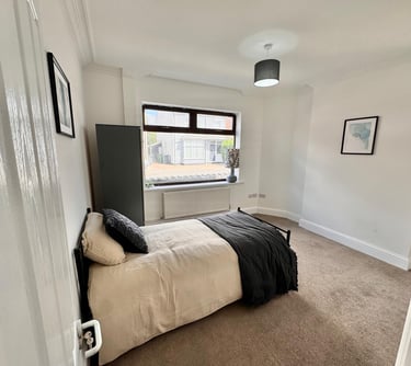 a bedroom with a bed and a wardrobe