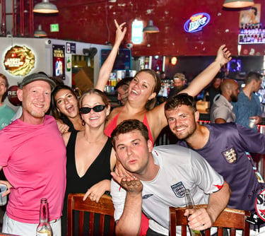 Friends celebrating the groom-to-be at Savannah Smiles with live entertainment, great drinks, and an