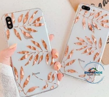 a woman holding a phone case with a rose gold leaf design