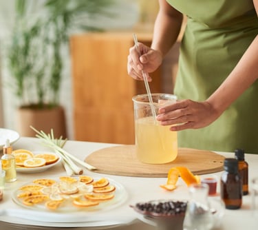 a woman in a green dress is holding a drink
