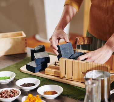 a person is holding a block of soap with a block of soap