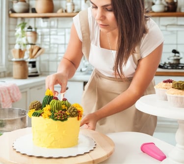 a woman in a white apron and aprons is cutting a cake