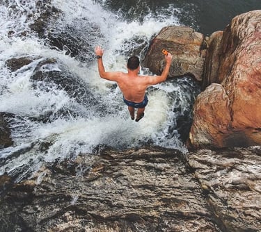 jumping into jacuzzi hole at Mkambati Falls