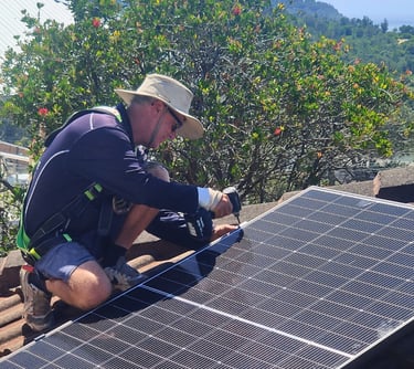 a man installing a solar panel