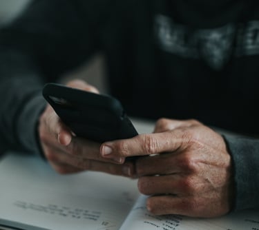 Photo of hands holding a phone