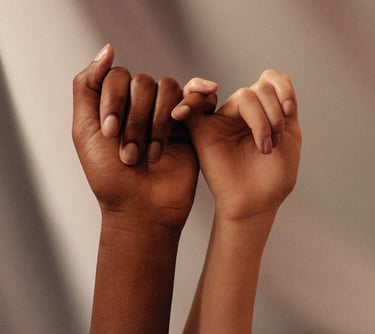 Photo of two hands linking their little fingers