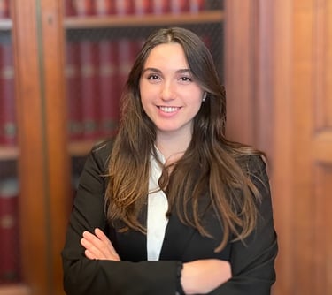 a woman in a suit and tie smiling