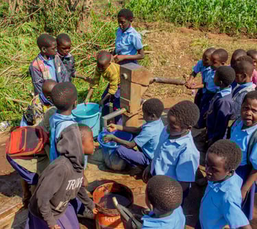 kids using well in Africa