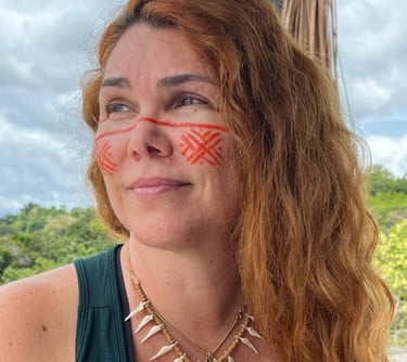 a woman with red and white painted face paint
