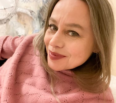 Close-up on Stefanie wearing a pink jumper.