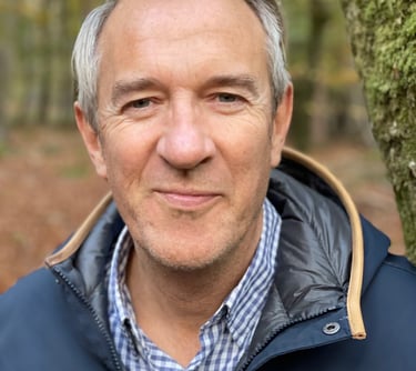 Well workplace specialist in a blue jacket posing for a photo