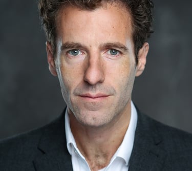 James Rose, a well workplace specialist, posing for a photo in a suit