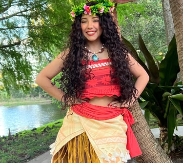 a woman in a hawaiian style costume