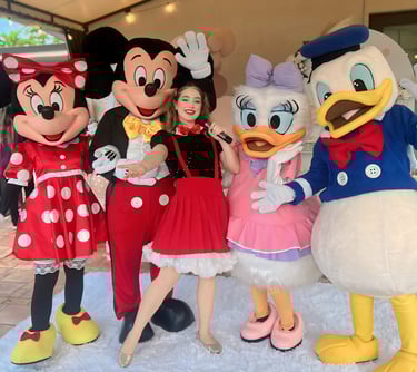 a group of people dressed in mickey mouse costume