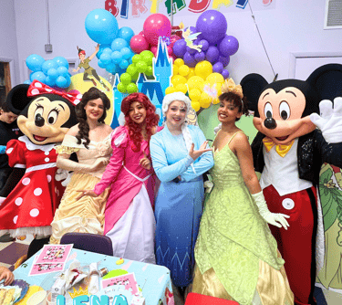 a group of people dressed in disney characters