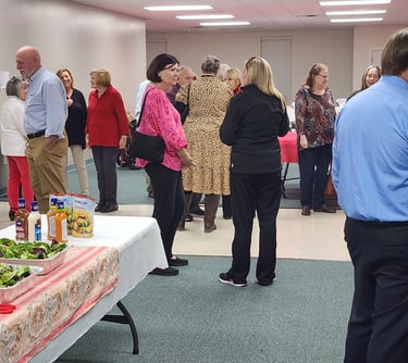 People standing and socializing at church