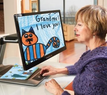 legally blind woman with amblyopia using enhanced vision acrobat magnifier reading for the blind