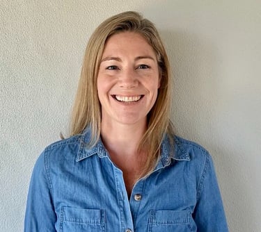 a woman in a denim shirt and jeans jacket