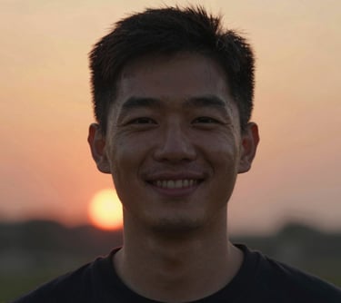 man standing near white wall