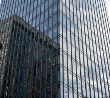 Modern abstract architectural detail of a glass building in a Brazilian financial center, representing corporate strength and legal security.