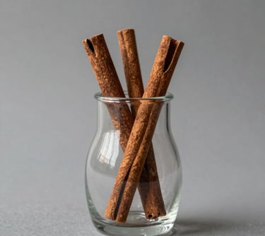 A sleek, modern vase with a smooth matte finish sitting on a wooden shelf against a soft neutral wall.